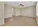 Spacious living room boasts a ceiling fan and tile flooring throughout at 2876 Rothesay Ave, Henderson, NV 89044