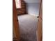 Neutral-toned bedroom featuring soft carpet, log walls, and a bright window at 311 Crestview Dr, Las Vegas, NV 89124