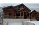 Charming log home with a stone base, covered entry, and natural wood accents at 311 Crestview Dr, Las Vegas, NV 89124