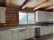 Bright kitchen with light cabinets, granite countertops, and a custom wood ceiling and walls at 311 Crestview Dr, Las Vegas, NV 89124