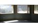 Spacious room with natural light beaming through the large windows showcasing beautiful views of the surrounding landscape at 311 Crestview Dr, Las Vegas, NV 89124