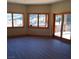 Bright room with scenic views through large windows and sliding glass doors to a balcony at 311 Crestview Dr, Las Vegas, NV 89124