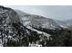 Scenic winter view of the snowy mountains and wooded landscape in the surrounding area of the property at 311 Crestview Dr, Las Vegas, NV 89124