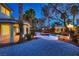 Lush backyard featuring a pool, rock features, and elegant lighting at 3235 S Tioga Way, Las Vegas, NV 89117