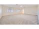 Spacious bedroom featuring large windows and neutral carpeting and baseboards at 3235 S Tioga Way, Las Vegas, NV 89117
