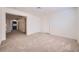 Open bonus room area with neutral carpet, white walls, baseboards, and lots of natural light at 3235 S Tioga Way, Las Vegas, NV 89117