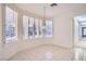 Breakfast nook featuring large windows, white shutters, and tile floors at 3235 S Tioga Way, Las Vegas, NV 89117