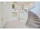 Bright foyer featuring tile floors, staircase, and second floor overlook at 3235 S Tioga Way, Las Vegas, NV 89117
