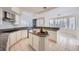 Bright kitchen with granite counters, island, and stainless steel appliances at 3235 S Tioga Way, Las Vegas, NV 89117
