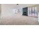 Spacious living room with a fireplace and bright windows with plenty of natural light at 3235 S Tioga Way, Las Vegas, NV 89117
