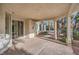 Covered patio area with cement flooring and lots of sunlight at 3235 S Tioga Way, Las Vegas, NV 89117