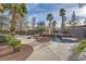 Beautiful backyard swimming pool with rock waterfall feature, surrounding garden, and gazebo create a luxurious paradise at 3235 S Tioga Way, Las Vegas, NV 89117
