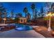 Backyard with a custom pool, waterfall features, and gazebo at 3235 S Tioga Way, Las Vegas, NV 89117