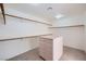 Spacious walk-in closet with built-in shelving and storage drawers, carpet flooring and bright recessed lighting at 3235 S Tioga Way, Las Vegas, NV 89117