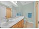 Bright bathroom featuring a vanity with cabinets, toilet, and shower at 337 Mattie Brook Ave, Henderson, NV 89015