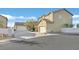 Exterior of a tan two-story home with tile roof and driveway at 337 Mattie Brook Ave, Henderson, NV 89015
