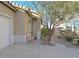 Inviting front porch with desert landscaping and a comfortable bench, perfect for relaxing at 337 Mattie Brook Ave, Henderson, NV 89015