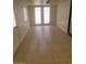 A small empty room with tile flooring, a door, and a window at 3480 E Hacienda Ave, Las Vegas, NV 89120