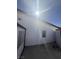 Side yard of the house with natural light hitting the house and backyard at 3480 E Hacienda Ave, Las Vegas, NV 89120