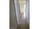 Tiled hallway with doors leading to bedrooms and bathrooms at 3480 E Hacienda Ave, Las Vegas, NV 89120