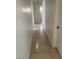 Hallway with tile flooring and neutral wall paint connecting various rooms at 3480 E Hacienda Ave, Las Vegas, NV 89120