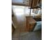 This kitchen has tile floors, wooden cabinets, a white range and a breakfast bar at 3480 E Hacienda Ave, Las Vegas, NV 89120