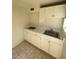 A small kitchenette with white cabinets at 3480 E Hacienda Ave, Las Vegas, NV 89120