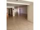 Spacious living room with tile floors and an open layout flowing into other rooms at 3480 E Hacienda Ave, Las Vegas, NV 89120
