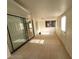 Bright living room with tile flooring, large sliding glass doors, and natural light at 3480 E Hacienda Ave, Las Vegas, NV 89120