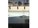 View of the empty in-ground pool and ladder in the backyard of this property at 3480 E Hacienda Ave, Las Vegas, NV 89120