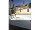 Backyard featuring an empty swimming pool with steps, concrete patio and stucco wall with decorative fence at 3480 E Hacienda Ave, Las Vegas, NV 89120