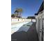 View of an empty in-ground pool in backyard of property on a clear day at 3480 E Hacienda Ave, Las Vegas, NV 89120
