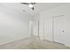 Bedroom featuring carpet flooring, a ceiling fan, and a closet with double doors at 371 Triple Falls St, Indian Springs, NV 89018