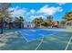 An aerial view of an outdoor basketball court with lush landscaping and modern architecture at 3860 Hildebrand Ln, Las Vegas, NV 89121