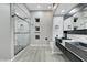 Modern bathroom with marble shower, sleek vanity, dual sinks, and contemporary design at 3860 Hildebrand Ln, Las Vegas, NV 89121