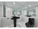 A modern bathroom with mirrored walls, a pedestal sink, and marble tile flooring at 3860 Hildebrand Ln, Las Vegas, NV 89121