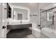 Modern bathroom with a sleek vanity, featuring updated fixtures and stylish tiling at 3860 Hildebrand Ln, Las Vegas, NV 89121