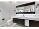 Stylish bathroom with modern lighting and floating vanity, combining functionality with contemporary design at 3860 Hildebrand Ln, Las Vegas, NV 89121