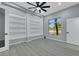 A modern bedroom with built-in shelving, large windows, and neutral color palette at 3860 Hildebrand Ln, Las Vegas, NV 89121