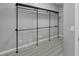Modern walk-in closet with custom shelving, sleek design, and ample storage space at 3860 Hildebrand Ln, Las Vegas, NV 89121