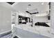 Well-lit kitchen with double ovens, marble countertops, and a spacious open layout for cooking and entertaining at 3860 Hildebrand Ln, Las Vegas, NV 89121