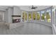 Bright living area with modern fireplace, wood floors and many windows at 3860 Hildebrand Ln, Las Vegas, NV 89121