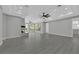 Large living room featuring wood floors, fireplace, recessed lighting, and many windows at 3860 Hildebrand Ln, Las Vegas, NV 89121