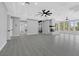 Spacious living area with fireplace, wood floors, recessed lighting, and windows at 3860 Hildebrand Ln, Las Vegas, NV 89121
