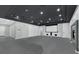 Spacious media room with gray carpet, custom cabinets, and a large projection screen for entertainment at 3860 Hildebrand Ln, Las Vegas, NV 89121