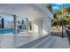 A spacious pool with a modern-designed home exterior and covered patio for outdoor relaxation at 3860 Hildebrand Ln, Las Vegas, NV 89121