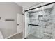 Modern bathroom features a spacious walk-in shower with marble-style tile surround at 3860 Hildebrand Ln, Las Vegas, NV 89121