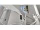 A modern staircase featuring high ceilings, natural light, and white accents at 3860 Hildebrand Ln, Las Vegas, NV 89121