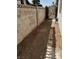 The side yard featuring a block wall fence and potential for landscaping at 3908 Montebello Ave, Las Vegas, NV 89110
