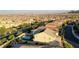 The house is displayed in an aerial view showing the pool, neighboring houses, and mountain scenery at 426 Port Reggio St, Las Vegas, NV 89138